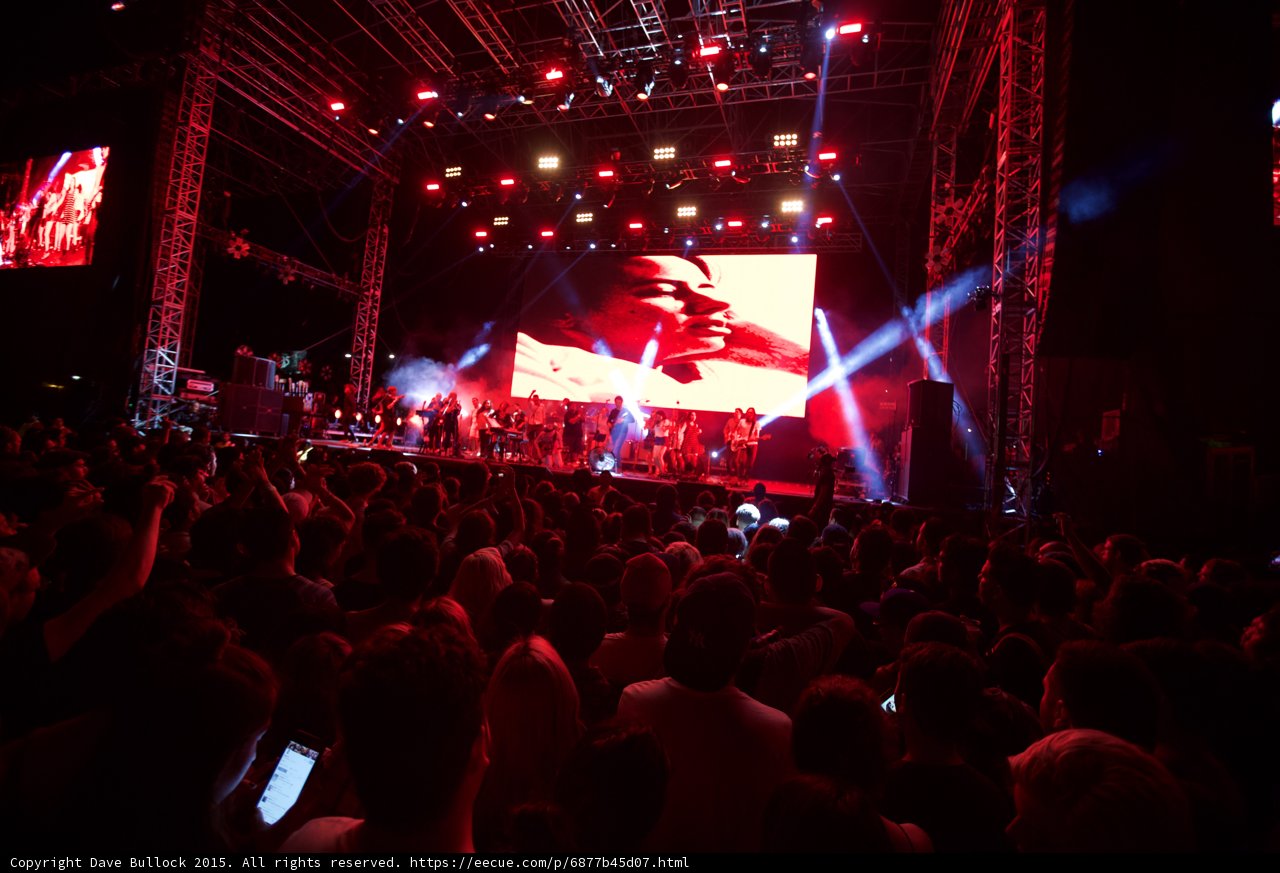 Belle and Sebastian Wide Stage Video Screen Romantic Face Red Lighting Spotlight Beams Crowd