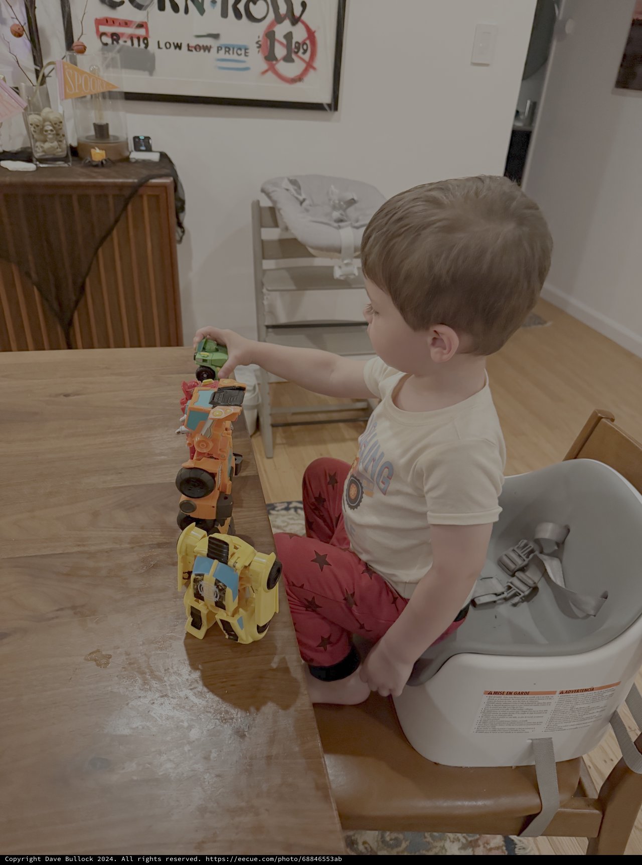 Toddler Playing with Toy Trains While Potty Training