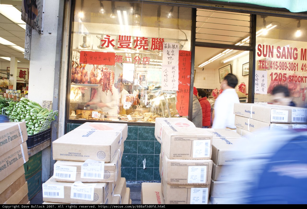 Man walking past storefront