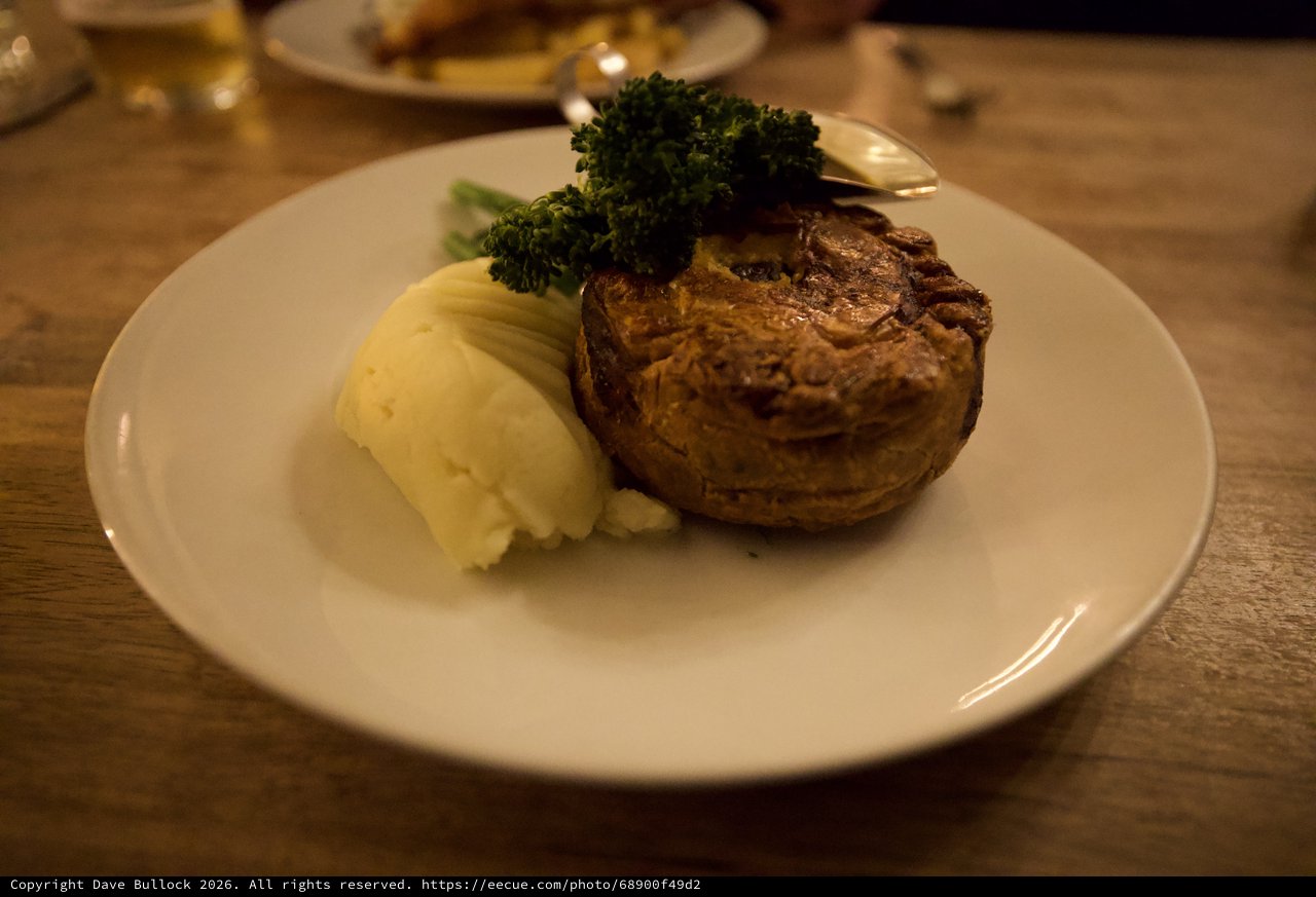 Traditional British Meat Pie with Mash and Broccoli