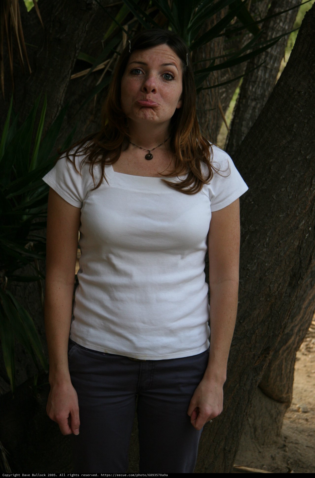 Playful Young Woman Making Funny Face Outdoors