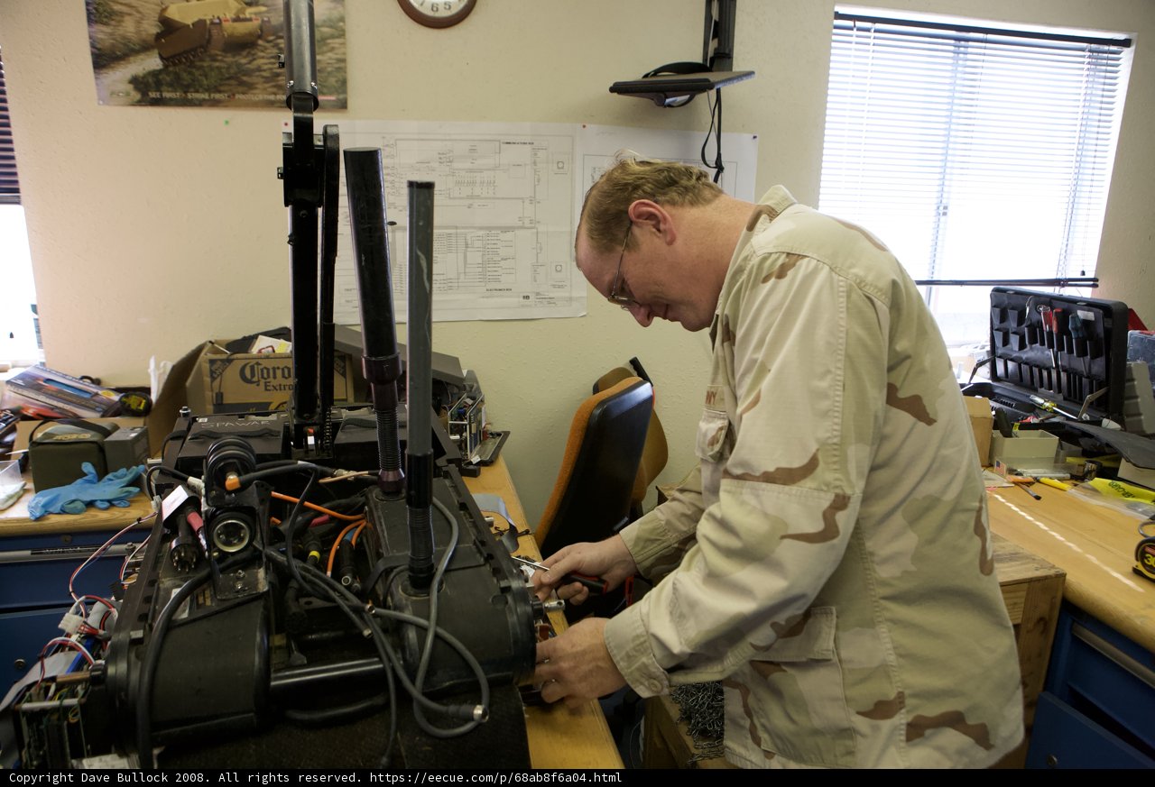 Military Man Working on Machine