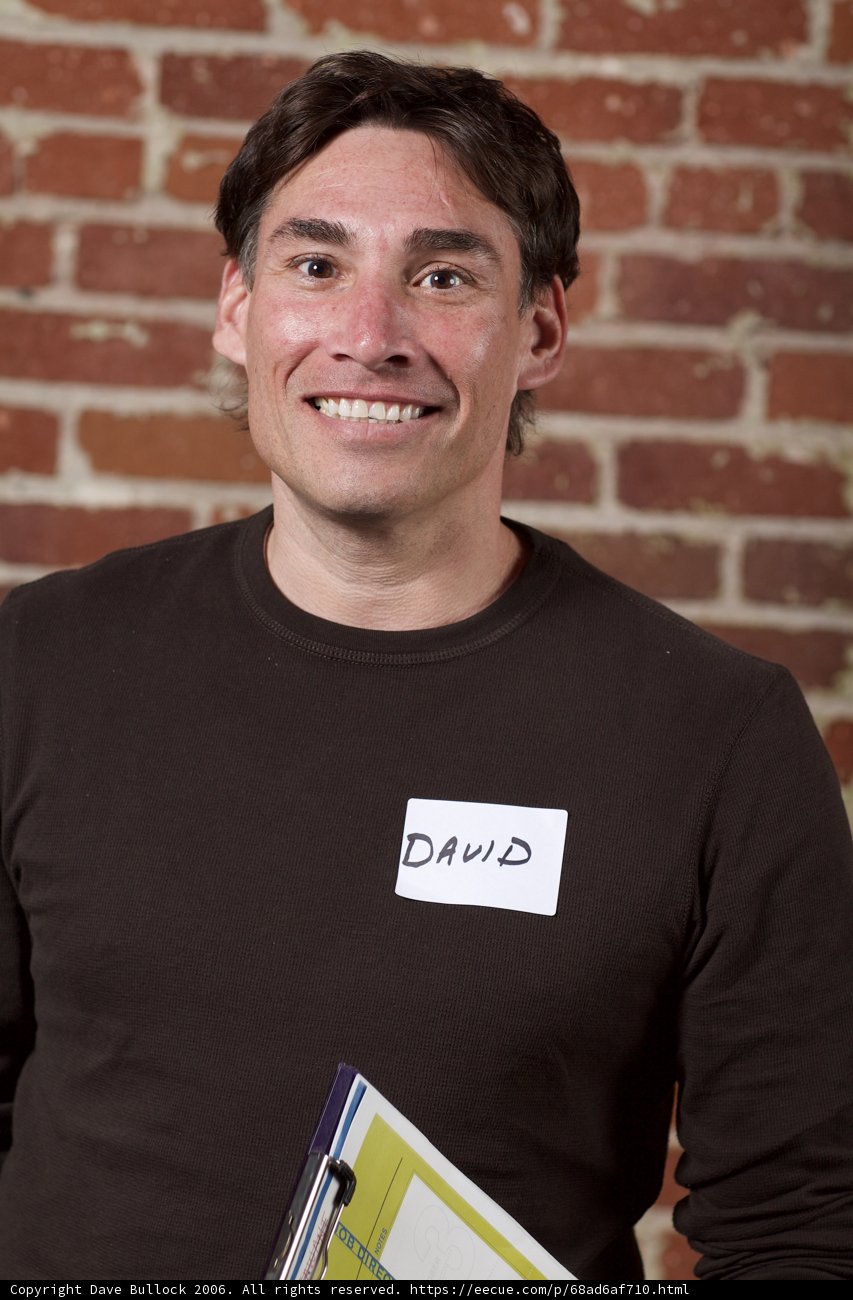 Smiling Man with Name Tag