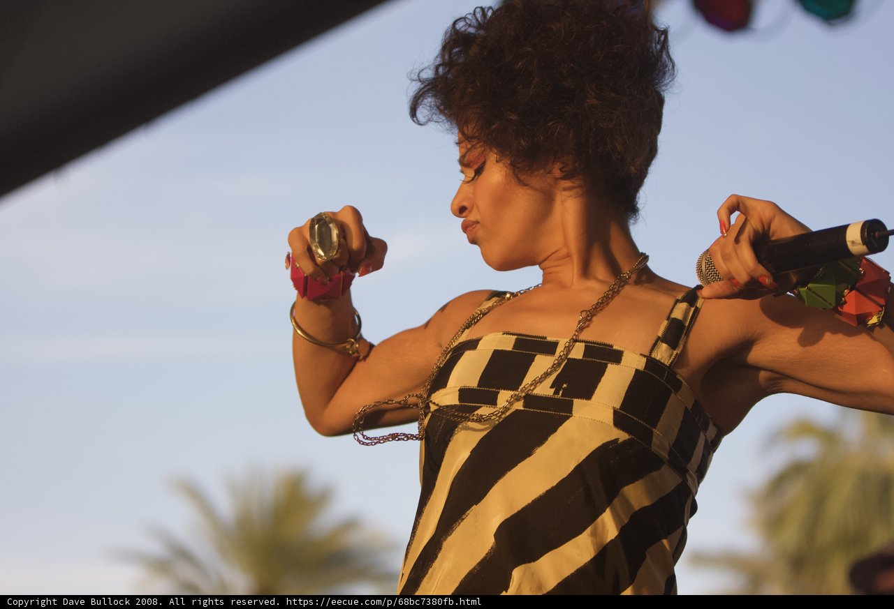Curly Haired Woman Performing on Stage