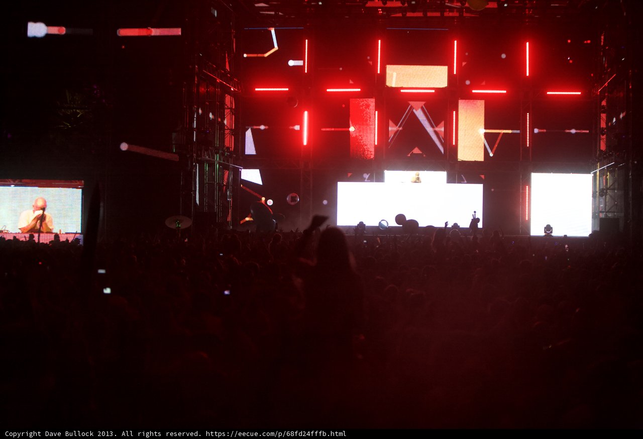 Coachella Crowd Rocks Out Under Vibrant Red Lights