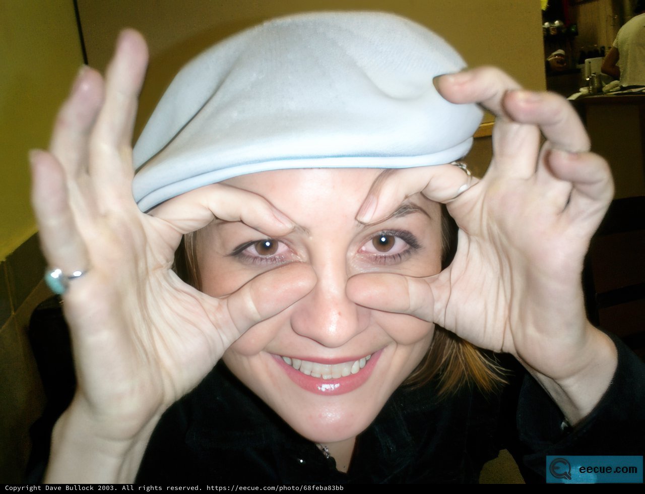Black-shirted Woman with a Beanie Cap