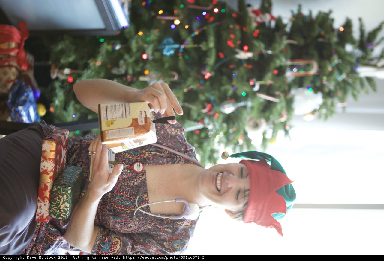Festive Nurse Elf Unwraps Christmas Panettone Gift