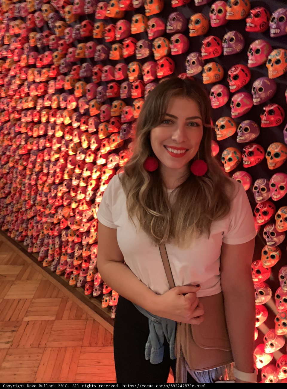 Smiling Woman Amongst Skulls