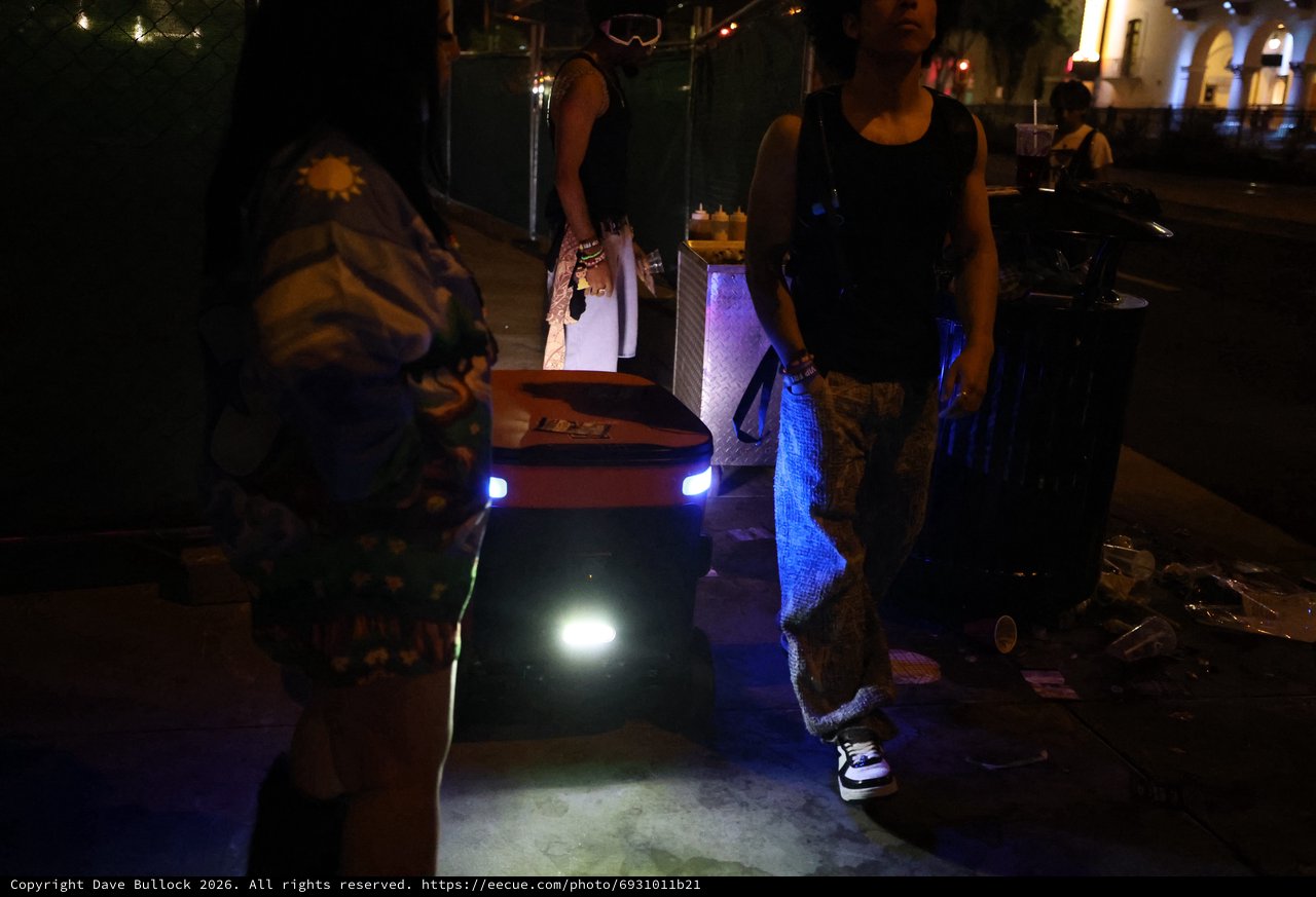 Delivery Robot Navigates Night Festival Crowd