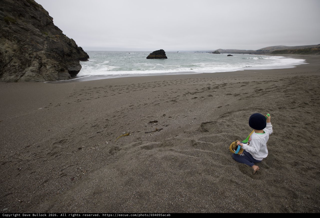 Solitary Child Playing on Dramatic Pacific Coastline