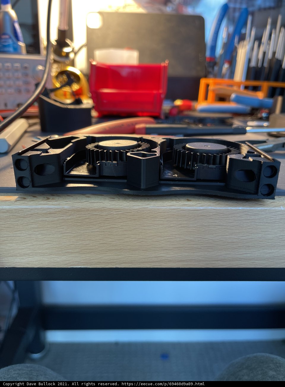 Wooden clamp holding computer hardware