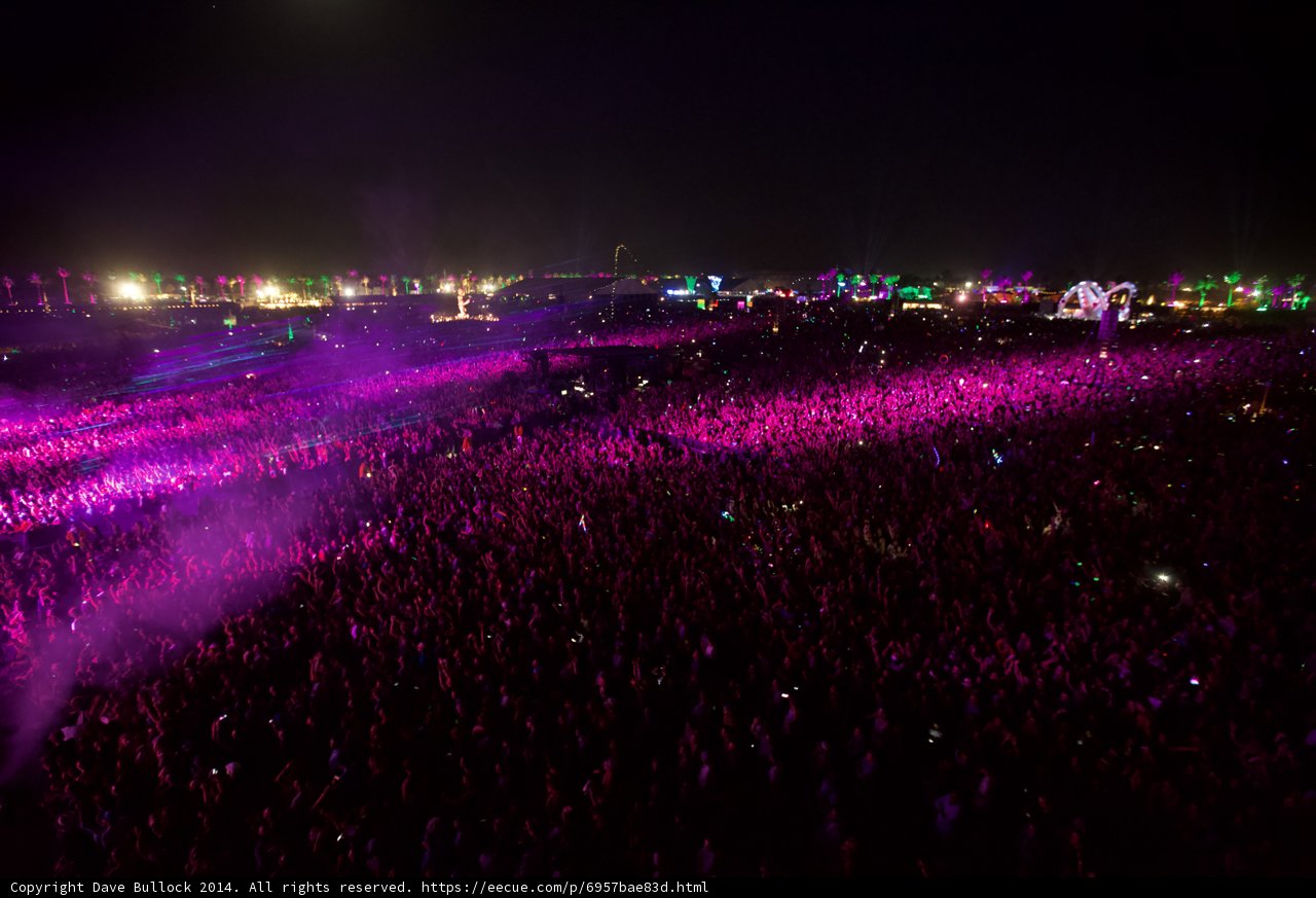 Festivalgoers Marvel at Night Sky and Lighting Display