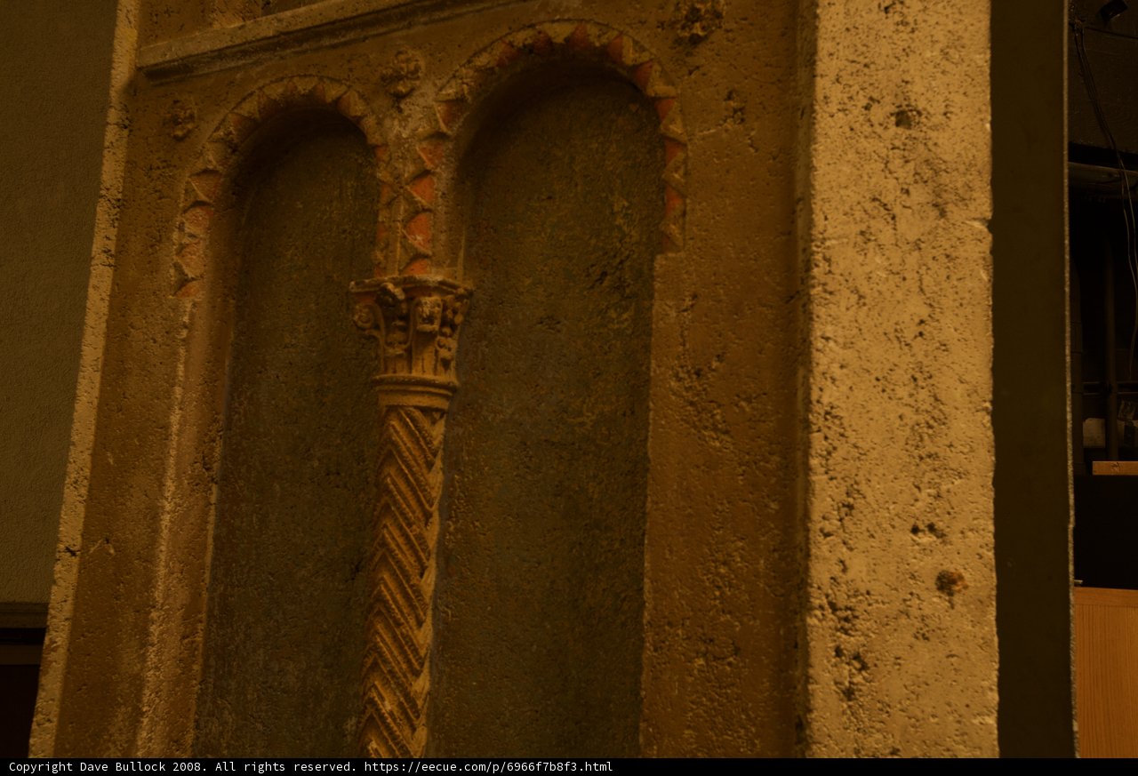 Antique Door and Clock on the Archeological Wall