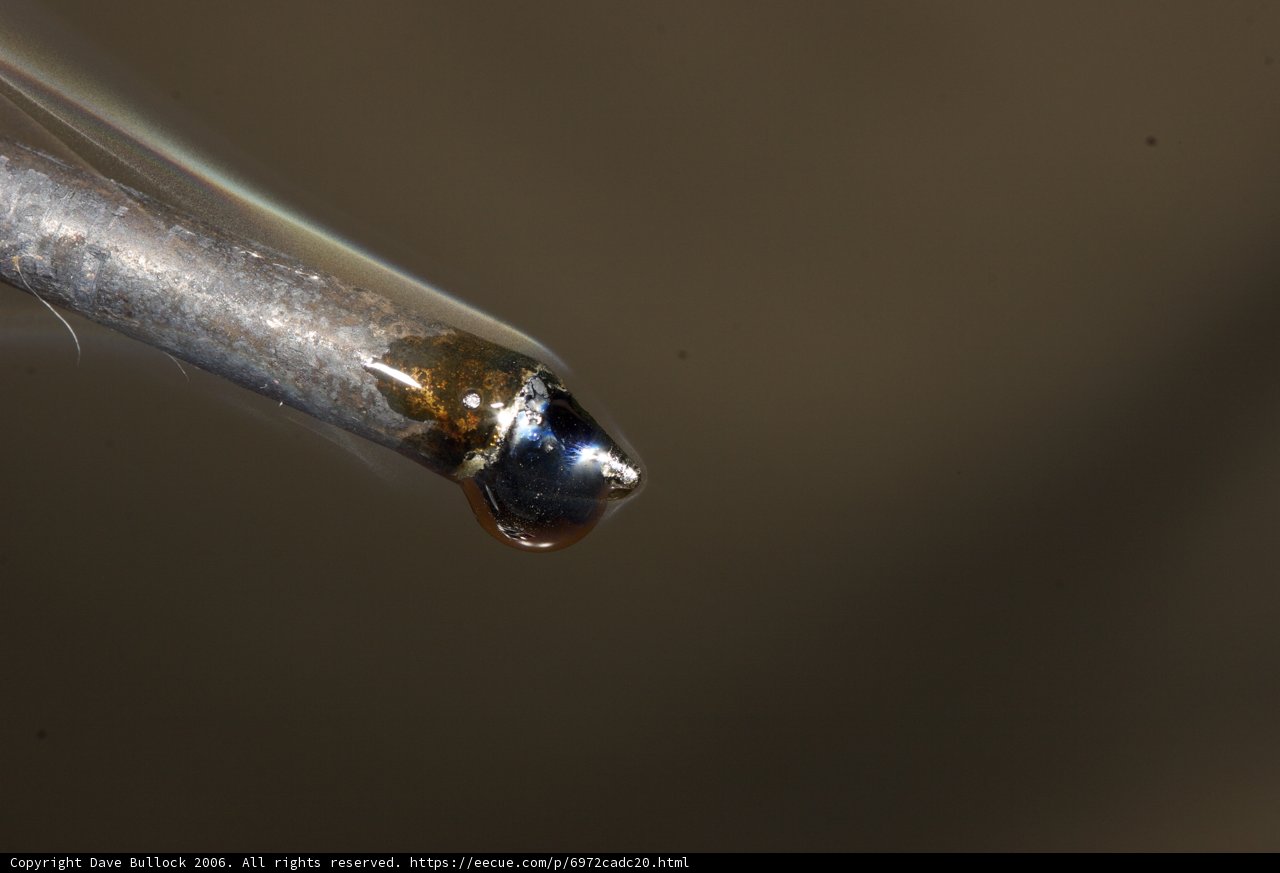 Magnified Metal Object with a Small Hole