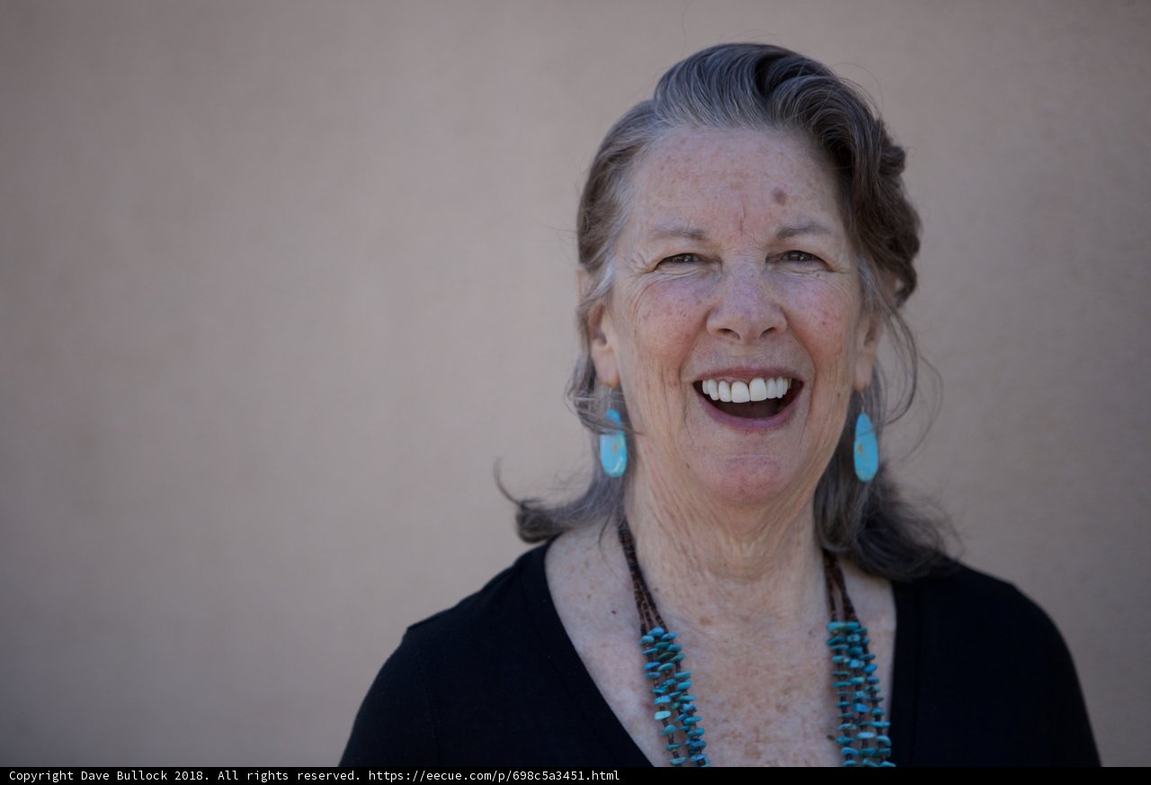 Blue Earrings and a Black Smile