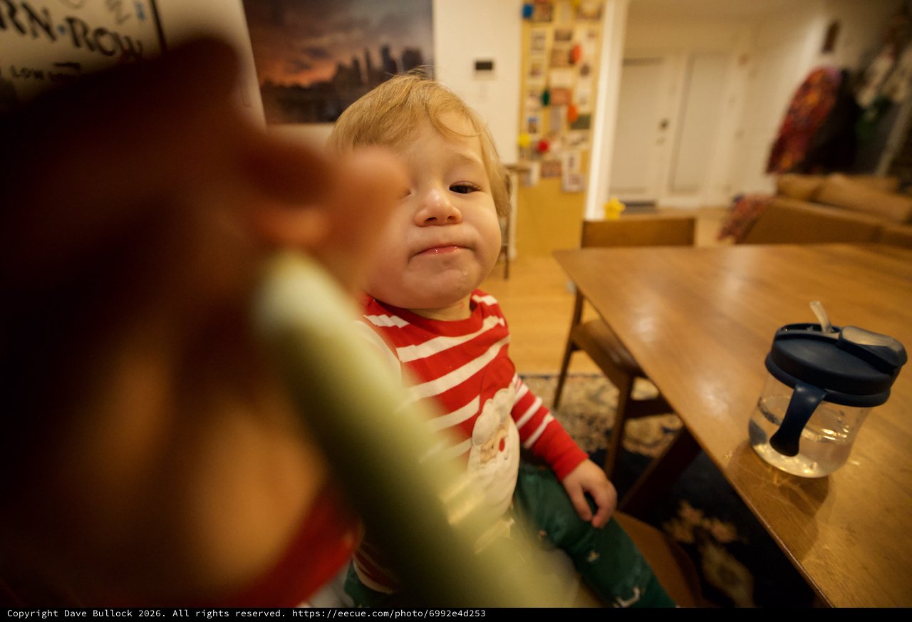 Young Child in Motion at Kitchen Table