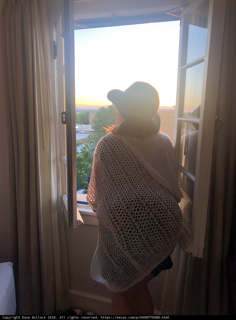Fashionable Woman in a White Sweater and Hat