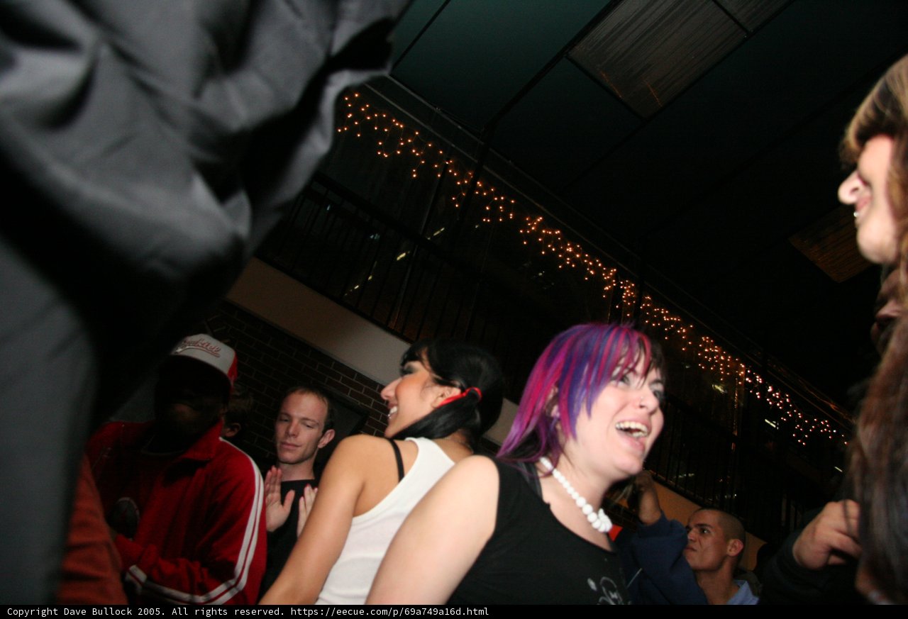 Nightlife Fun with Purple Hair and Black Jackets