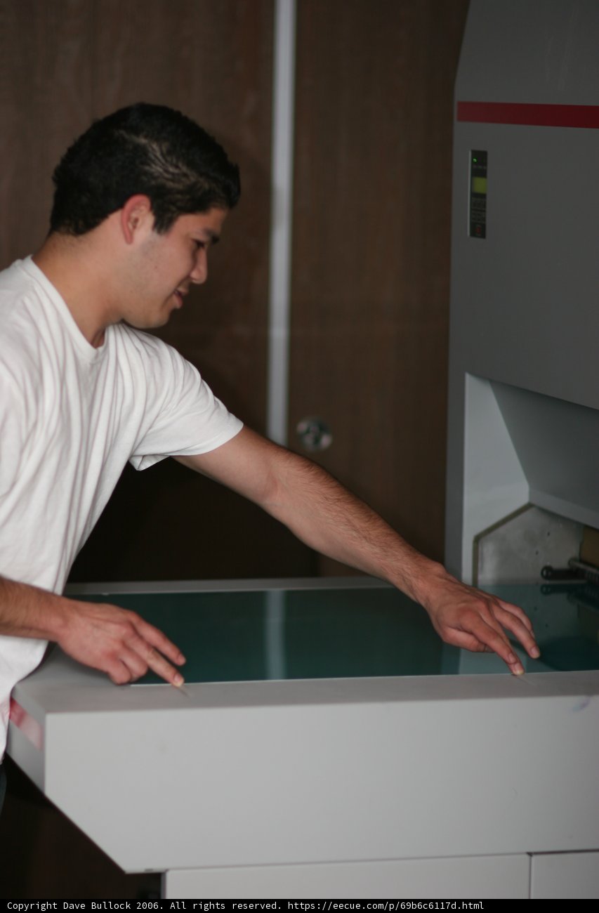 Man Working on Arcade Game Machine