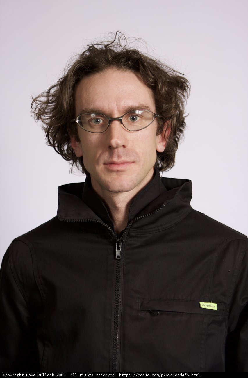 Man in Black Jacket with Glasses