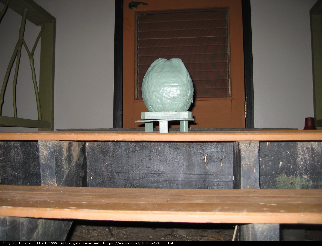 Green Vase on Wooden Table