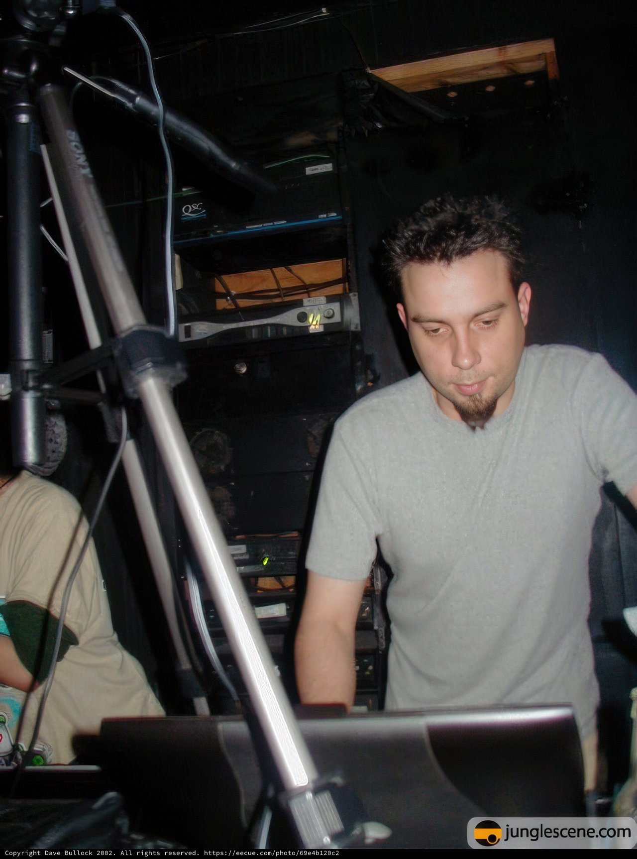 The Gray-Shirted Man on Stage