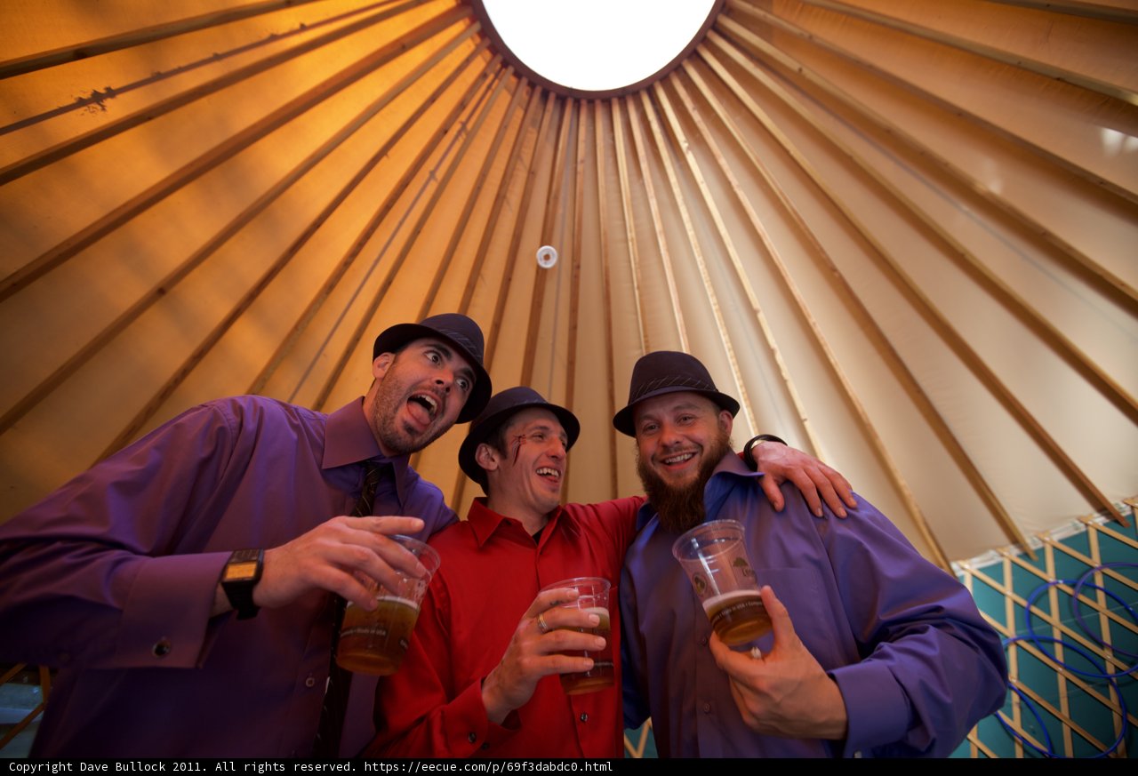 Three Men Cheers-ing at the Wedding