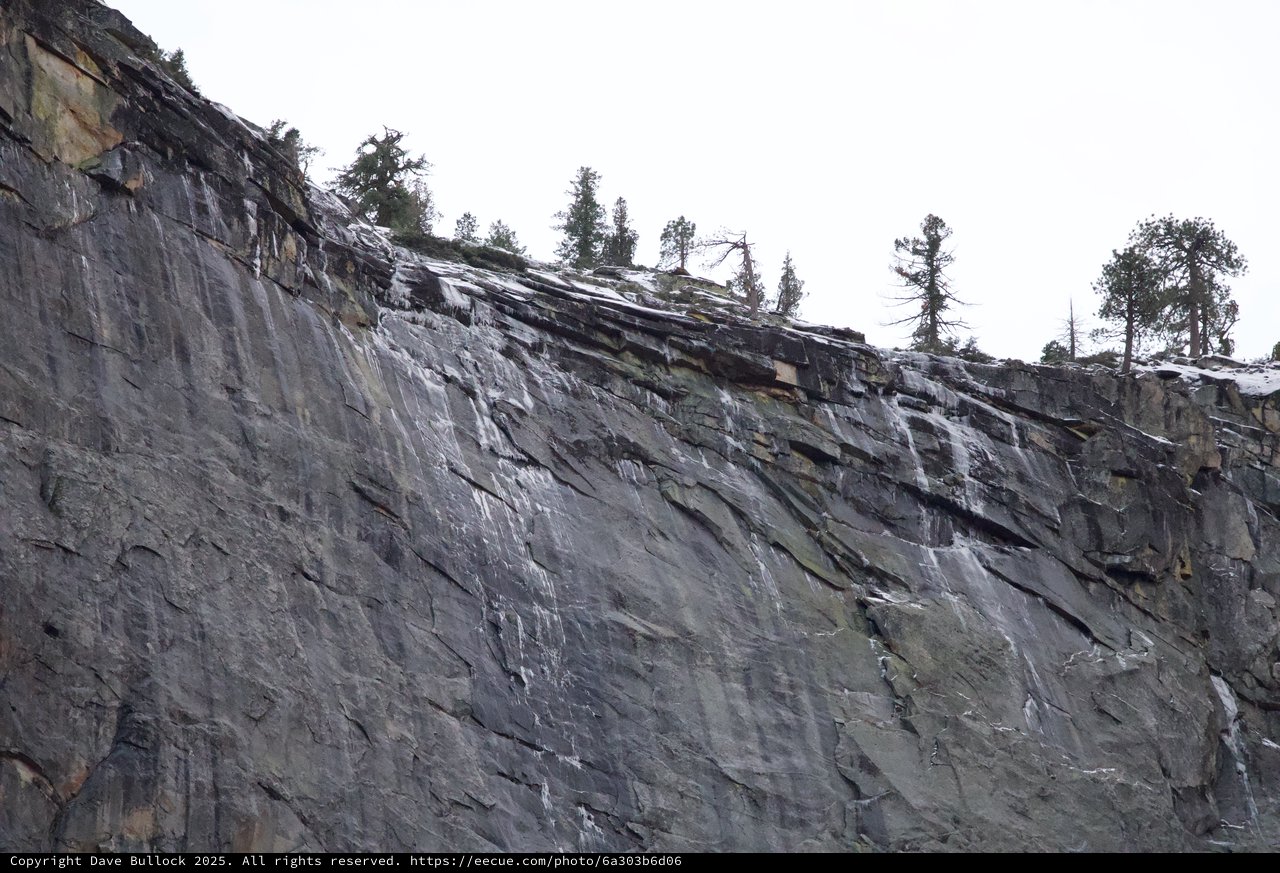 Dramatic Layered Rock Face in Snowy Winter Landscape