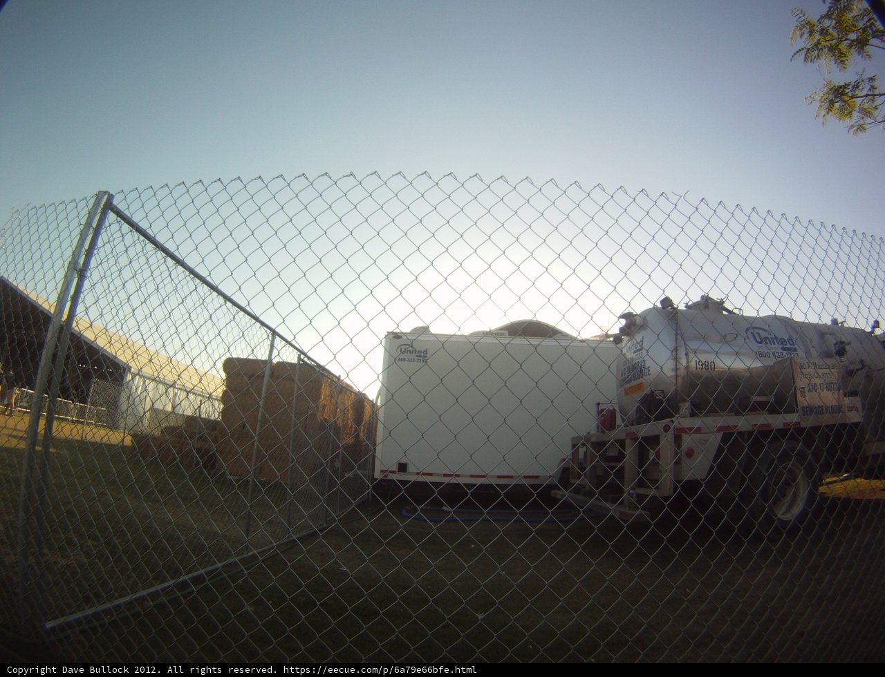 Parked Truck Behind Chain Link Fence
