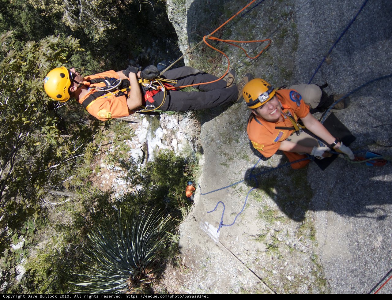Search and Rescue Team Rappelling Down Rocky Cliff