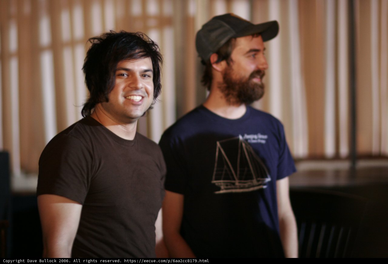 Smiling Duo in Baseball Caps
