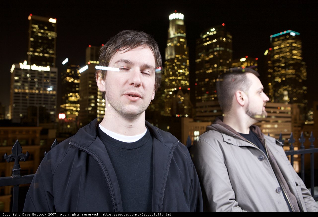 Night Skyline with Two Men standing in Downtown