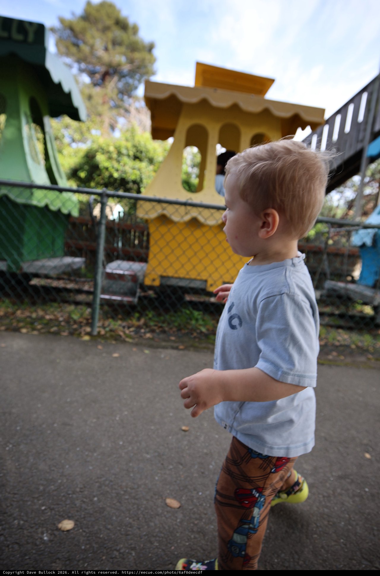 Young Boy Exploring Colorful Playground at Fantasyland