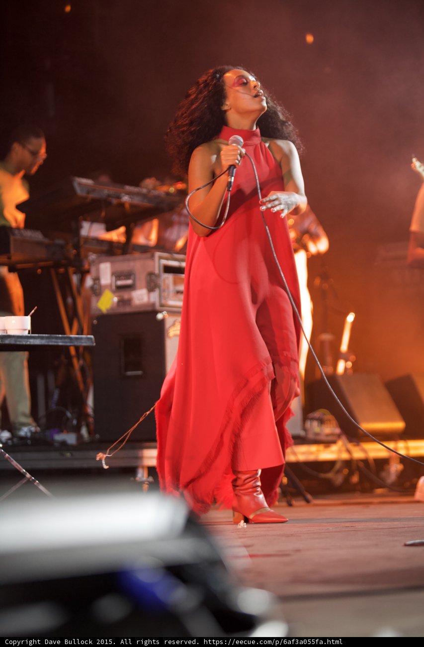 Solange Full Body Head Tilted Back Hand Extended Red Outfit Band