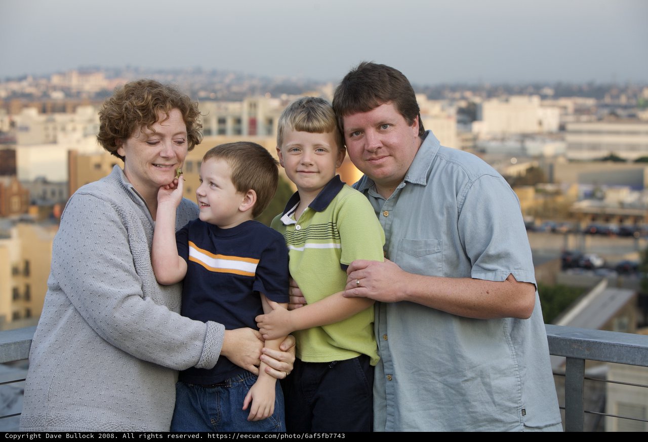 Family Portrait on Urban Rooftop at Dusk