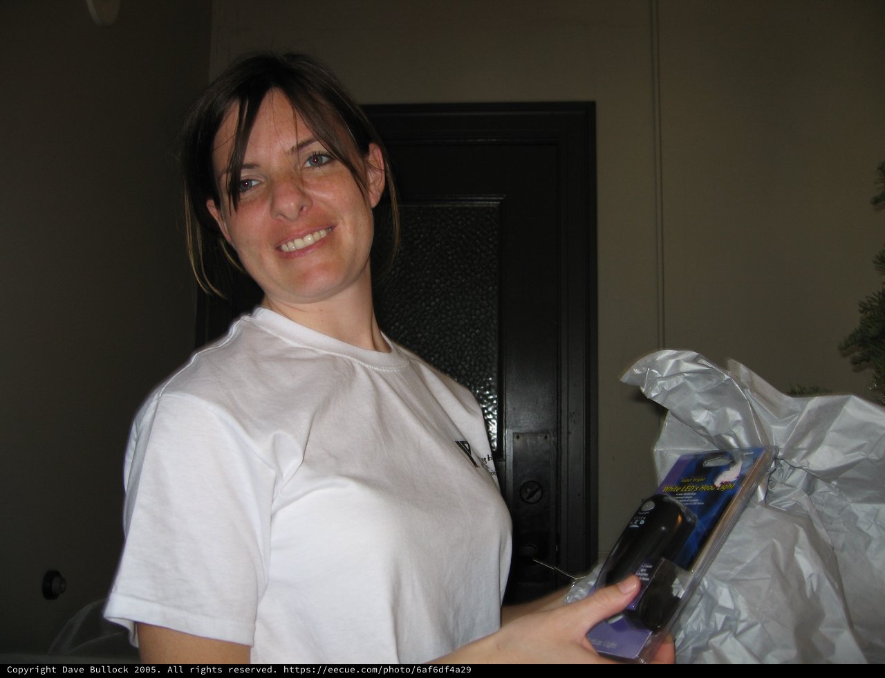 Woman Smiling With White LED Headlight Gift
