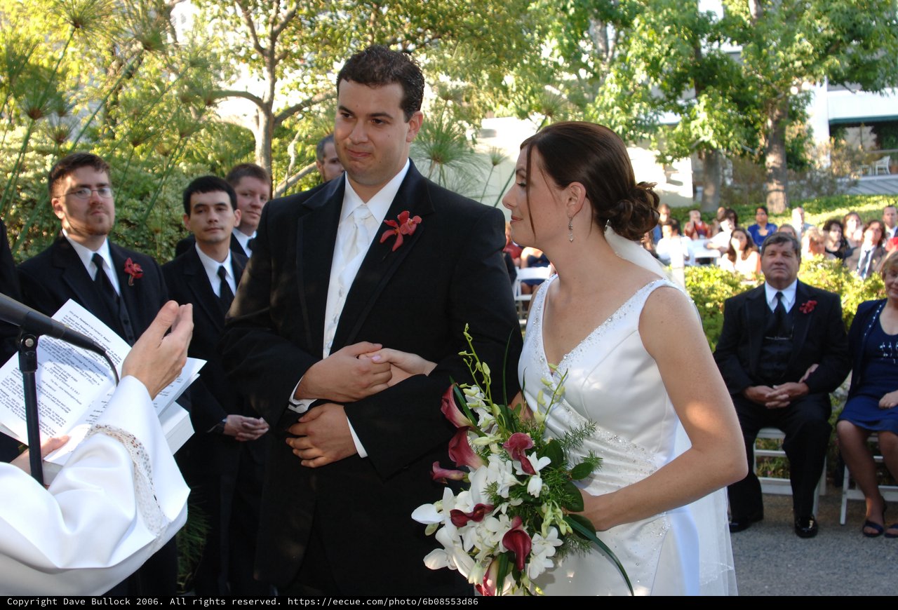 Bride and Groom Exchange Vows at Outdoor Wedding