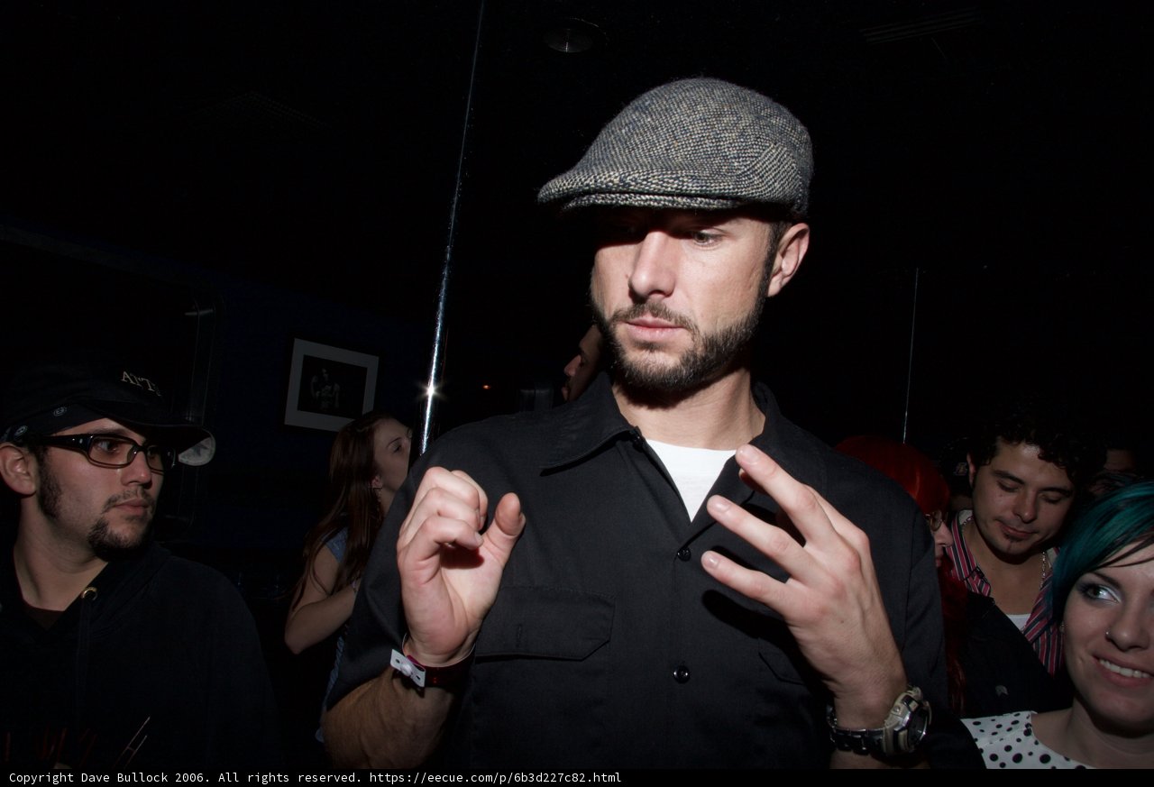 Hat-wearing man rocks the party