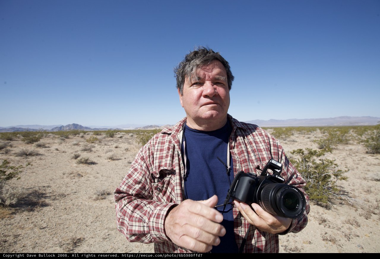 Desert Photographer Stands in Arid Mojave Landscape