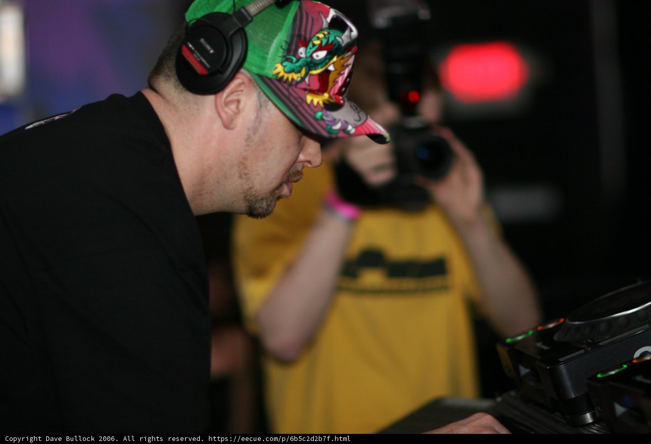 Entertainer in Black Shirt with Baseball Cap and Headphones