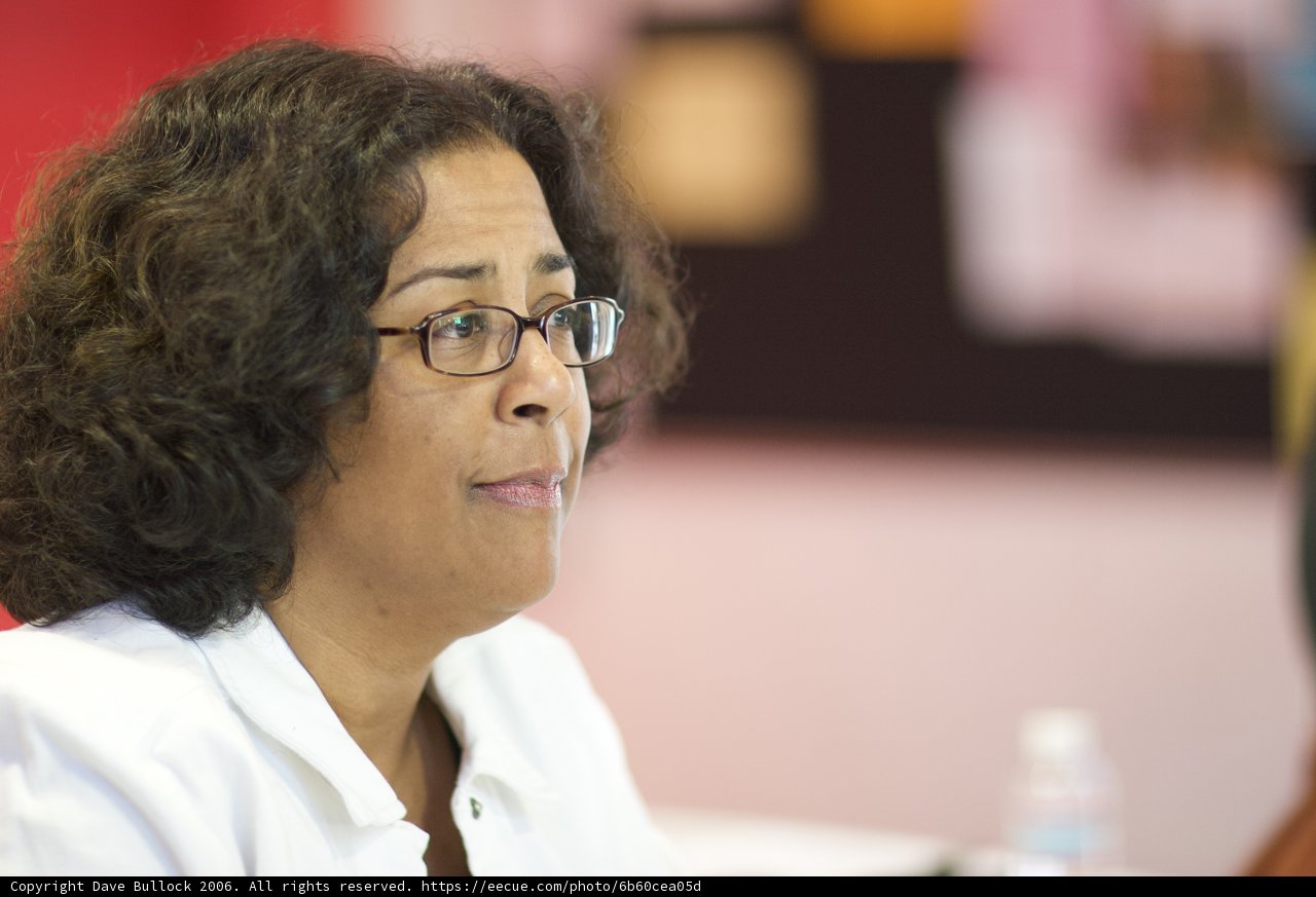 Curly-haired Woman with Glasses