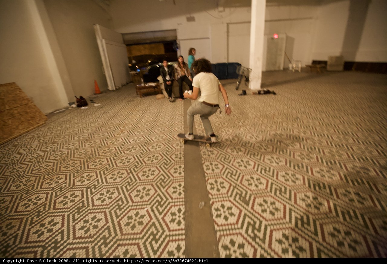 Skateboarder on Tiled Floor