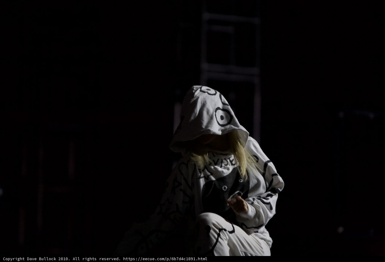 Hoodie-Clad Woman Takes a Break