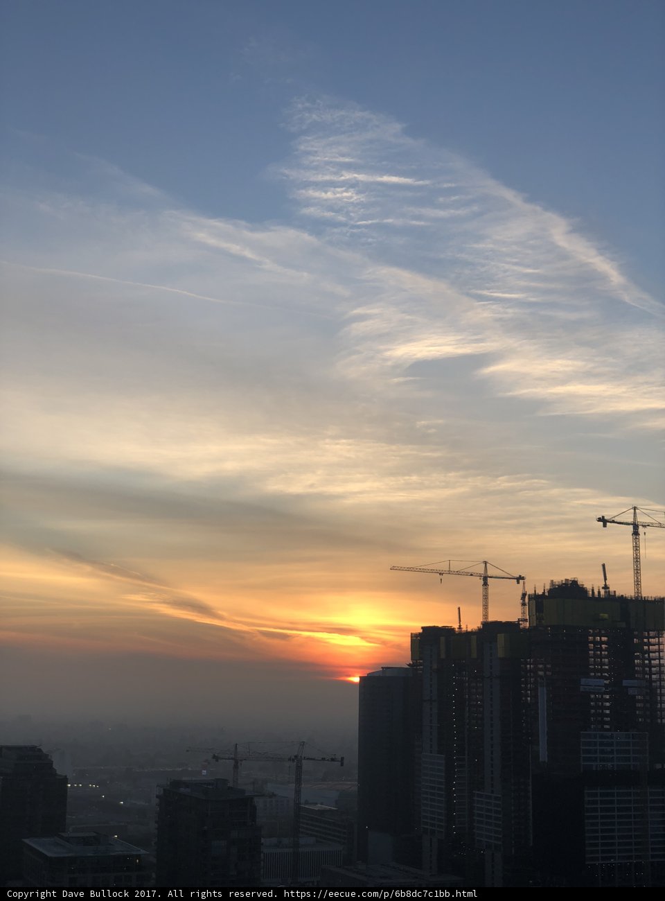 City Sunset with Construction Cranes