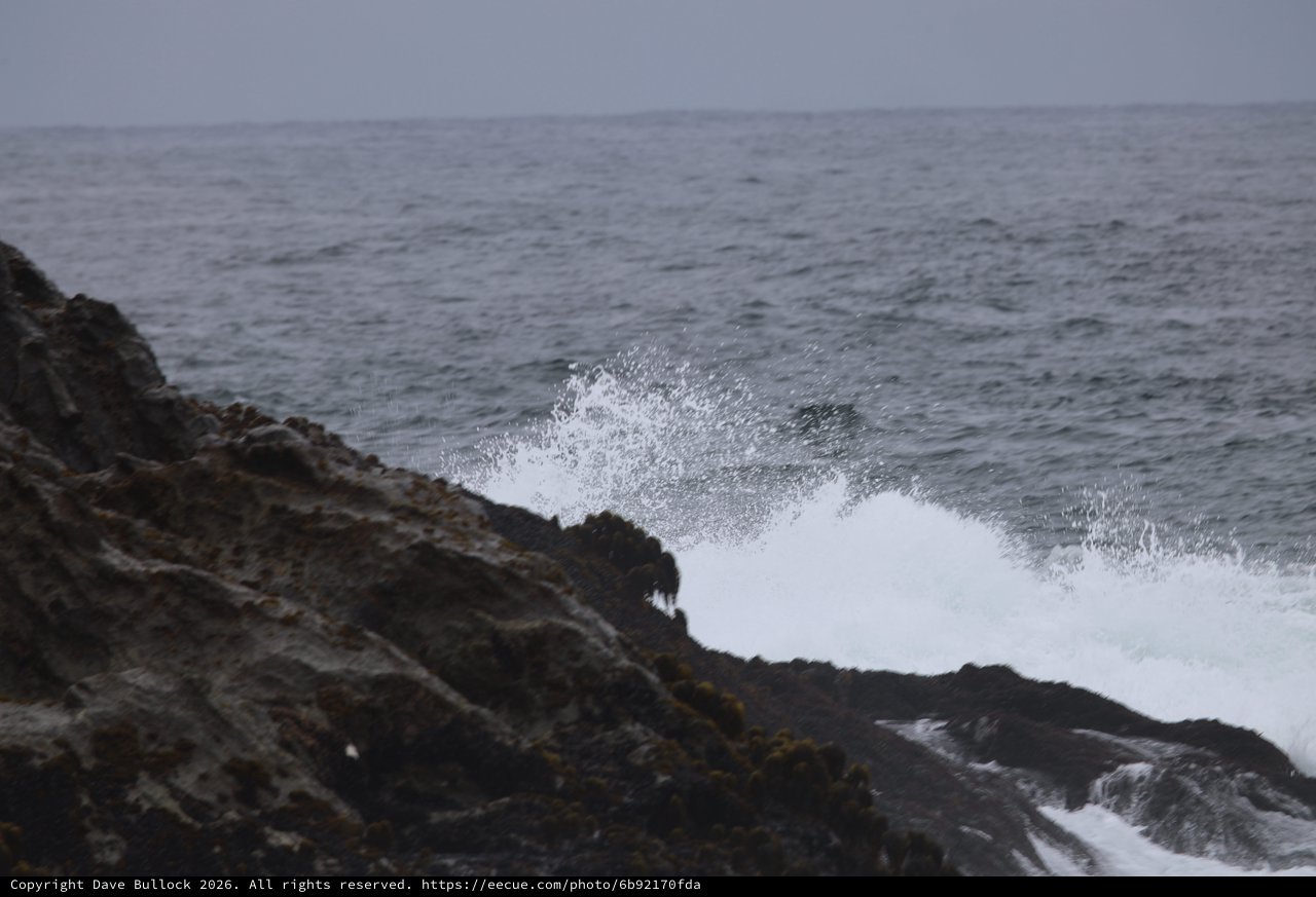 Wild Atlantic Waves Crashing Against Dark Rocky Shore