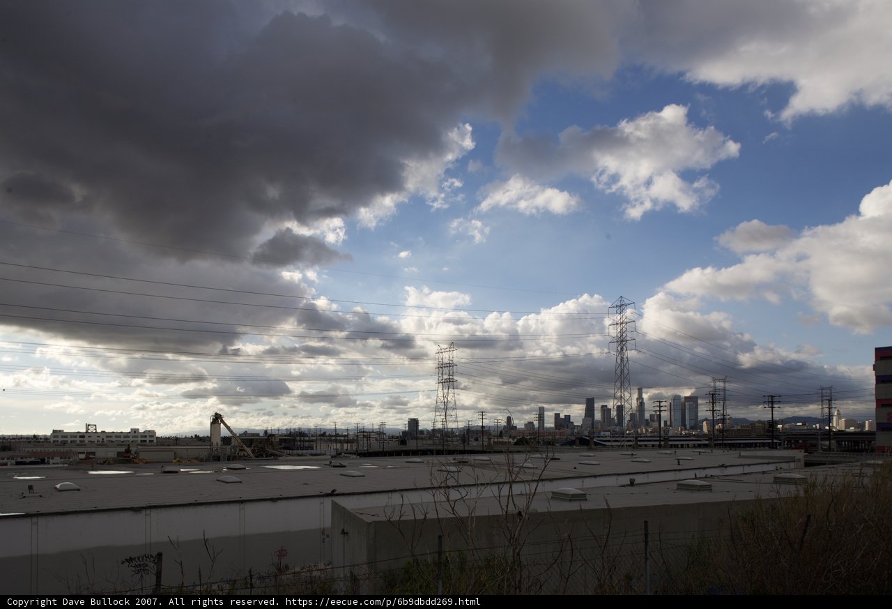 Cumulus Clouds over Industrial Landscape