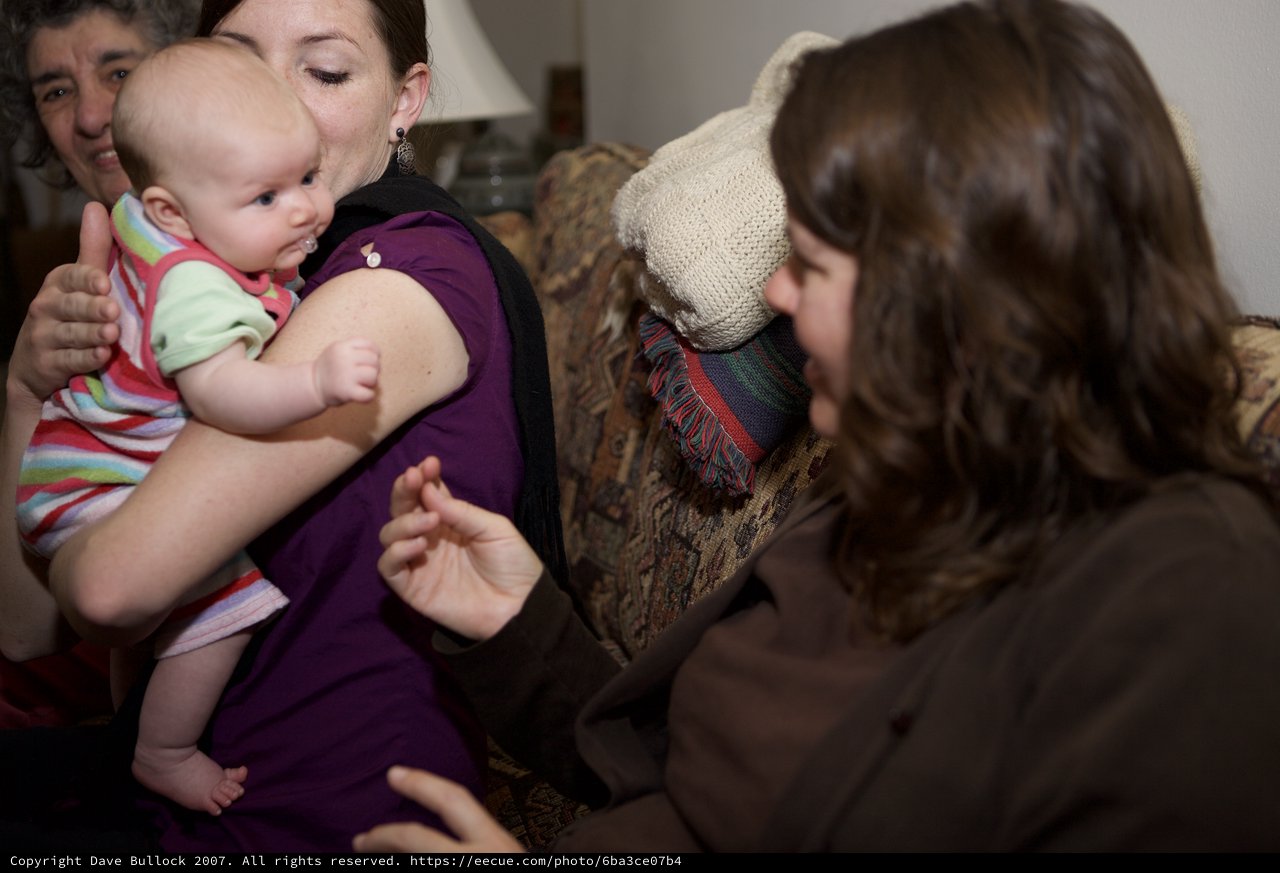 Three Generations Share a Tender Indoor Moment