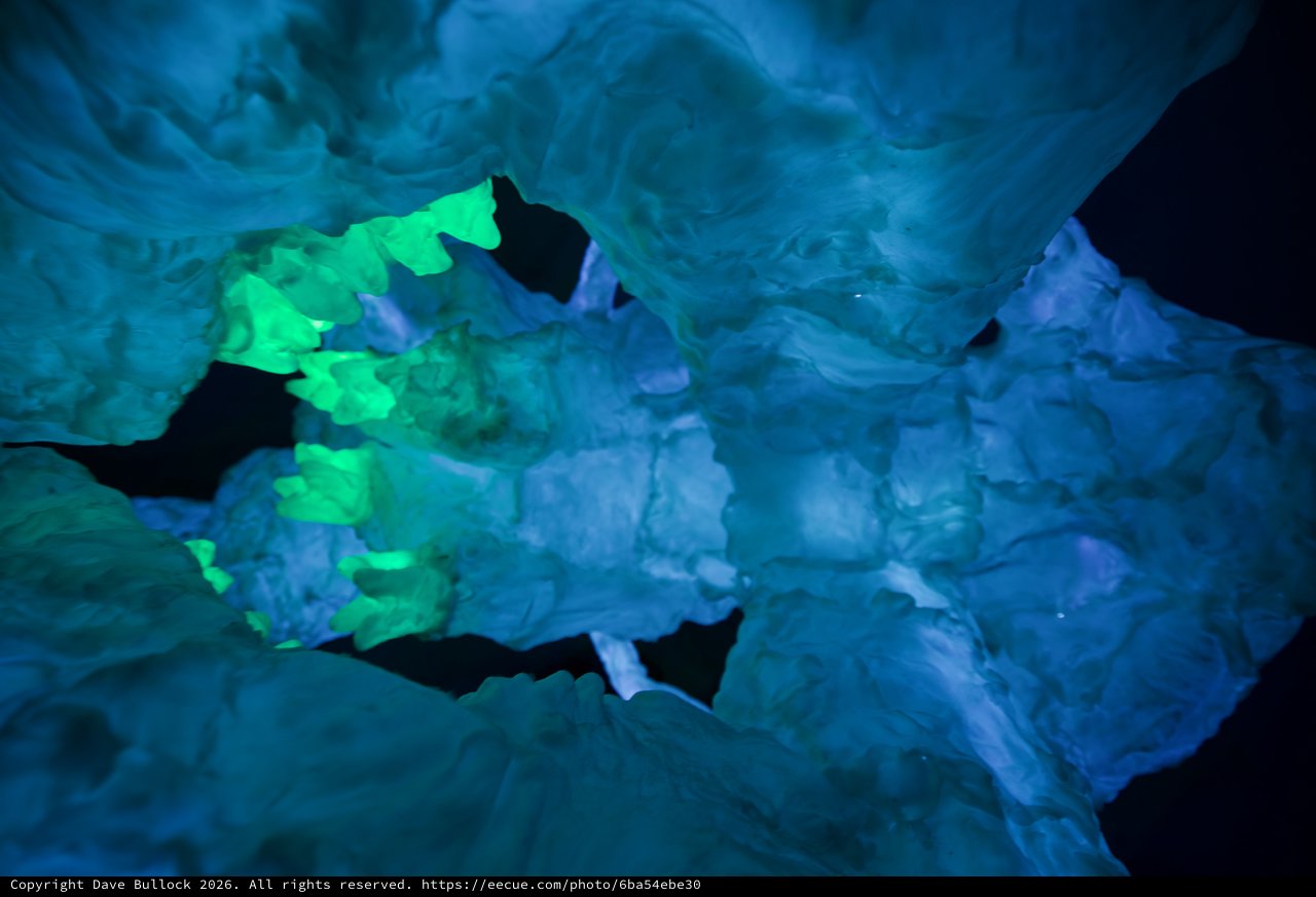 Illuminated Ice Formations in Underground Cave