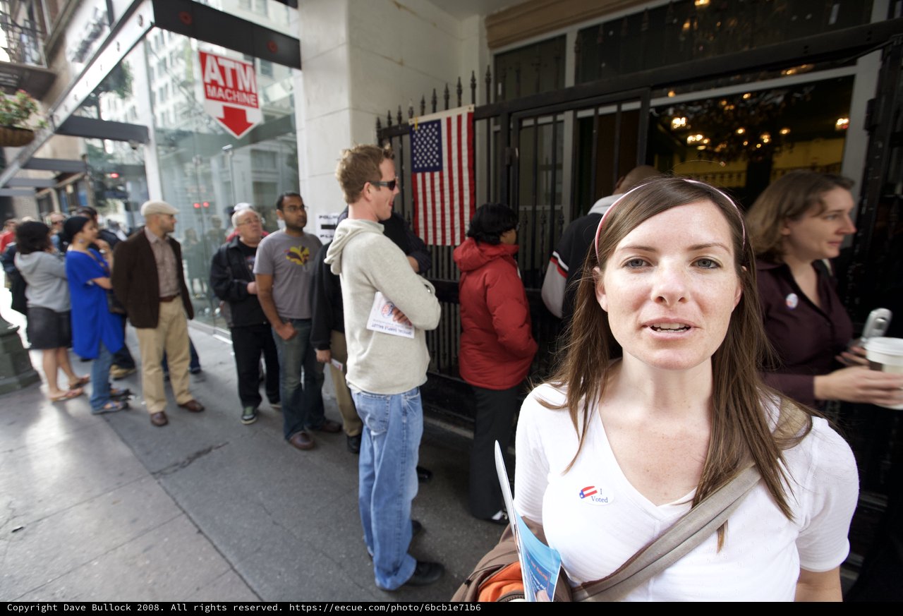 Proud Voter Stands Outside Polling Place on Election Day