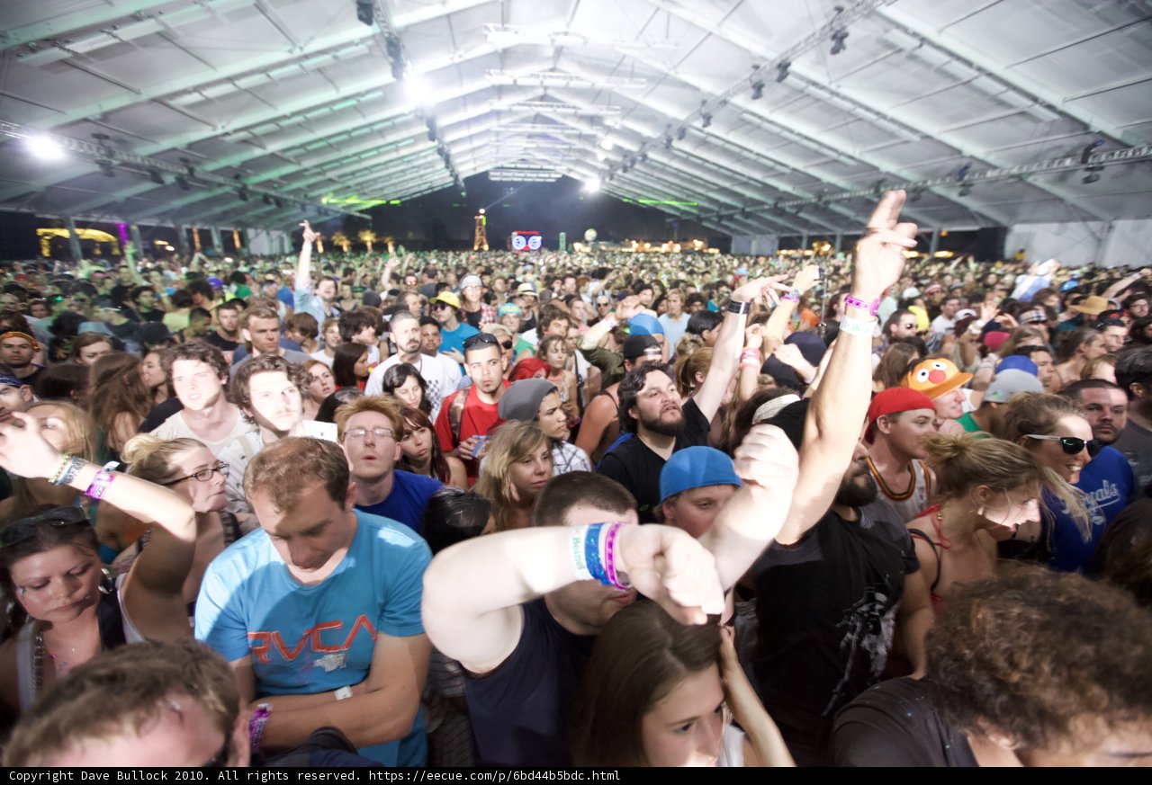 Coachella's Eclectic Crowd Caption: Gina Hathorn and Amelie Kiefer join thousands of music lovers at the Coachella Music and Arts Festival, showcasing a variety of clothing, headgear, and accessories.